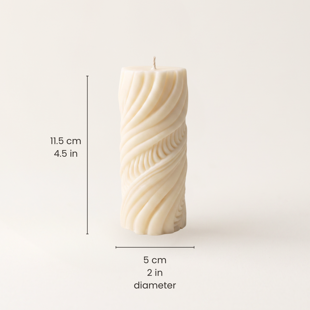 An off-white twisted pillar candle with dimension lines and text indicating a height of 11.5 cm and 5cm in diameter 