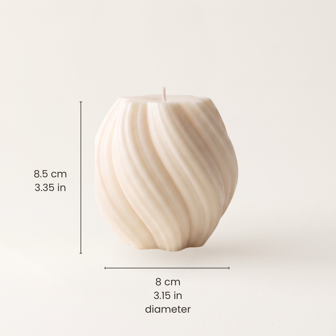 An off-white ribbed pillar candle shown on a light beige background with dimension lines and text indicating a height of 8.5 cm (3.