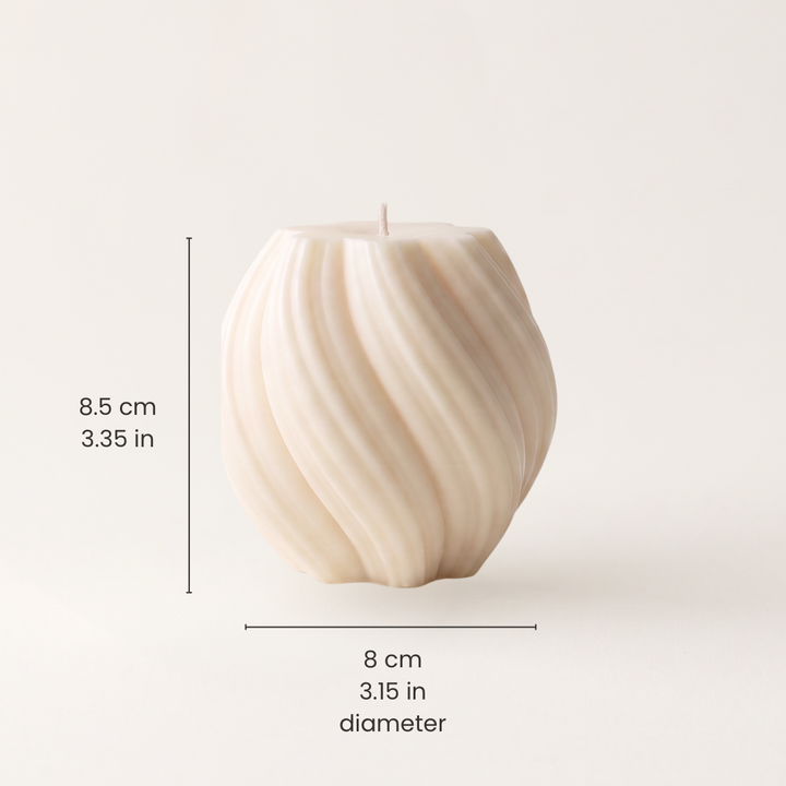 An off-white ribbed pillar candle shown on a light beige background with dimension lines and text indicating a height of 8.5 cm (3.